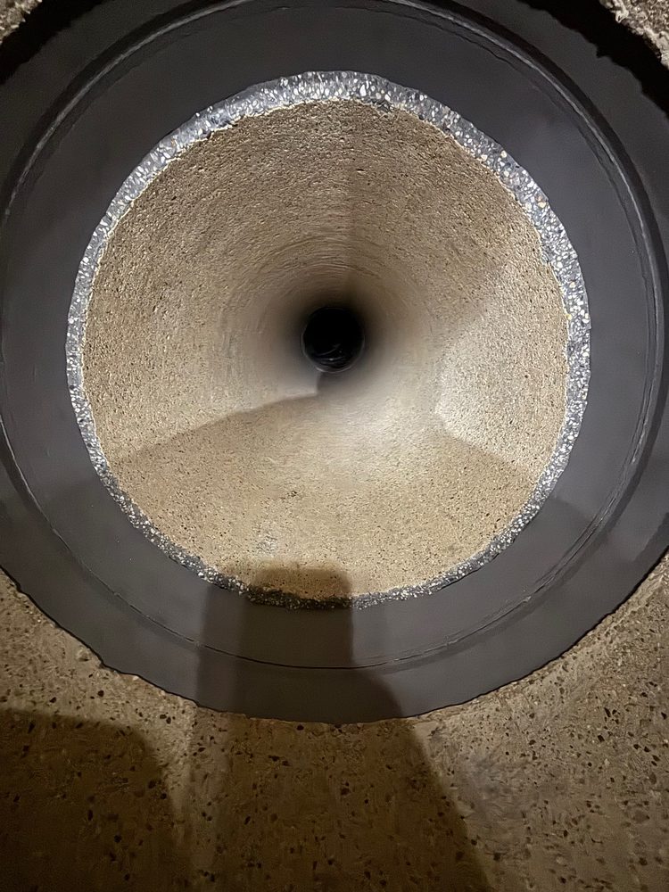 Prepared concrete pipe surface, cleaned and profiled for carbon-fiber lining