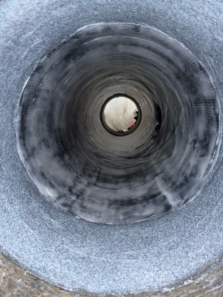 Completed carbon-fiber pipe lining with topcoat applied, back in service
